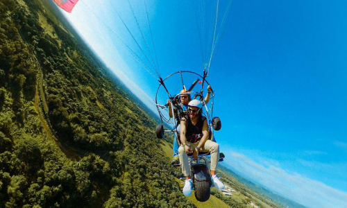 a-person-is-parasailing-in-the-water-on-a-sunny-day