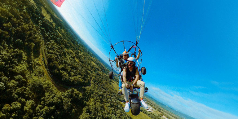 a-person-is-parasailing-in-the-water-on-a-sunny-day